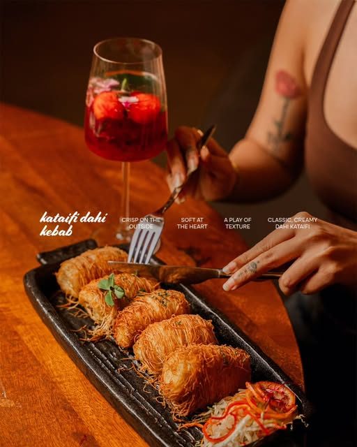 Kataifi dahi kebab on a black platter