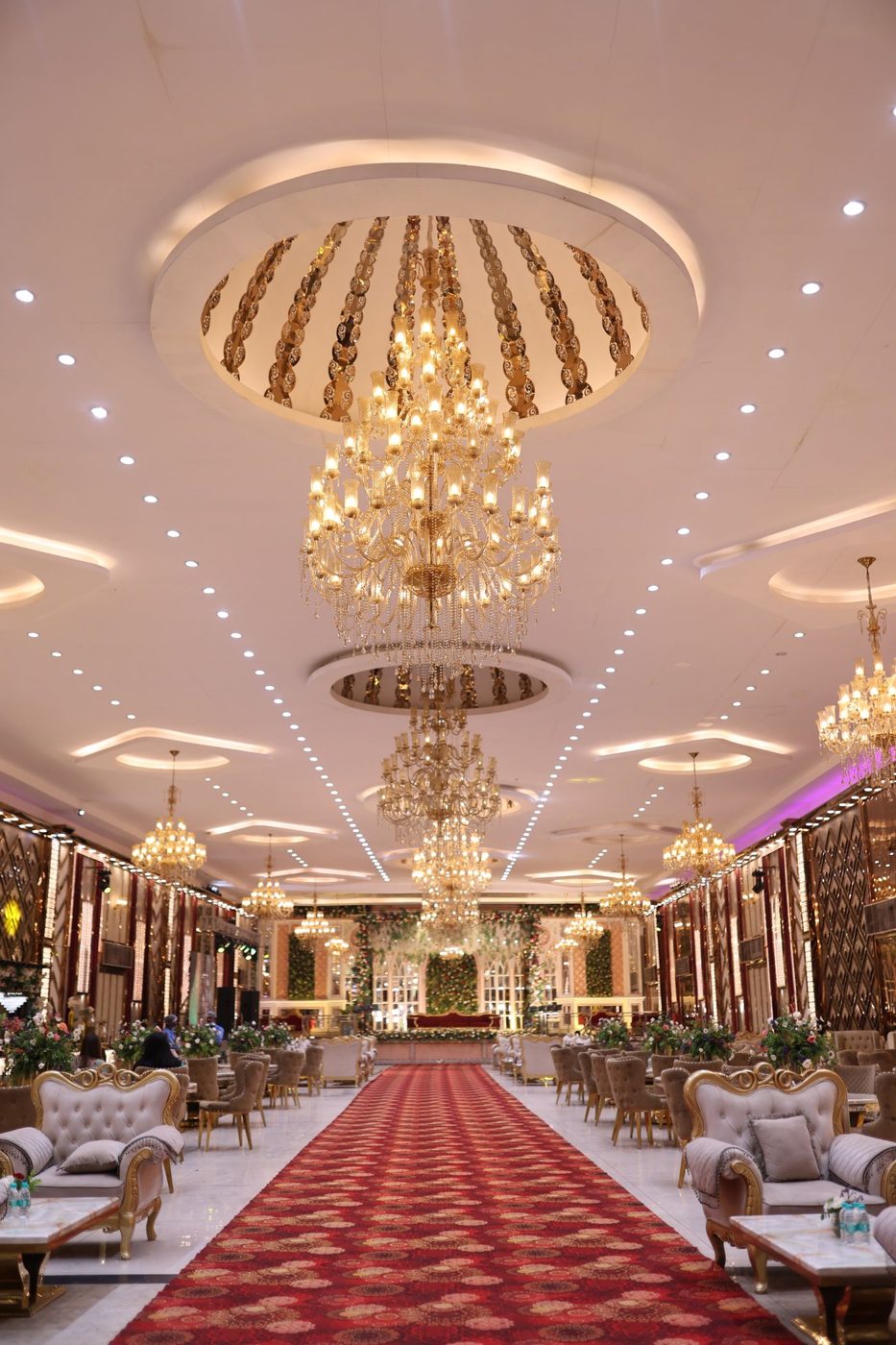 A banquet hall dressed for a function with chandeliers